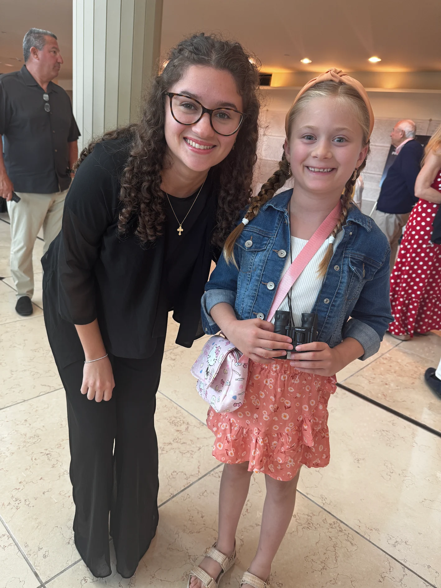 Victoria with a young student at a concert hall performance